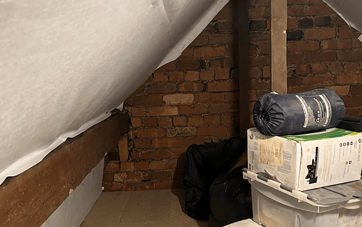 Organized loft storage with neatly packed boxes for efficient space use