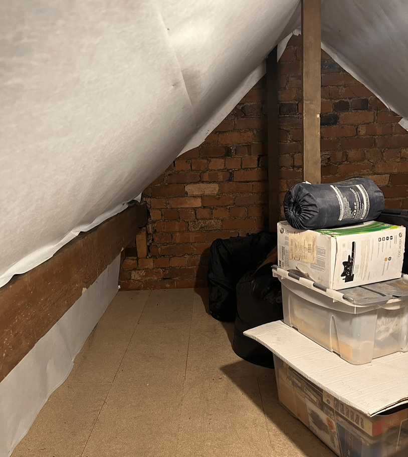 Organized loft storage with neatly packed boxes for efficient space use